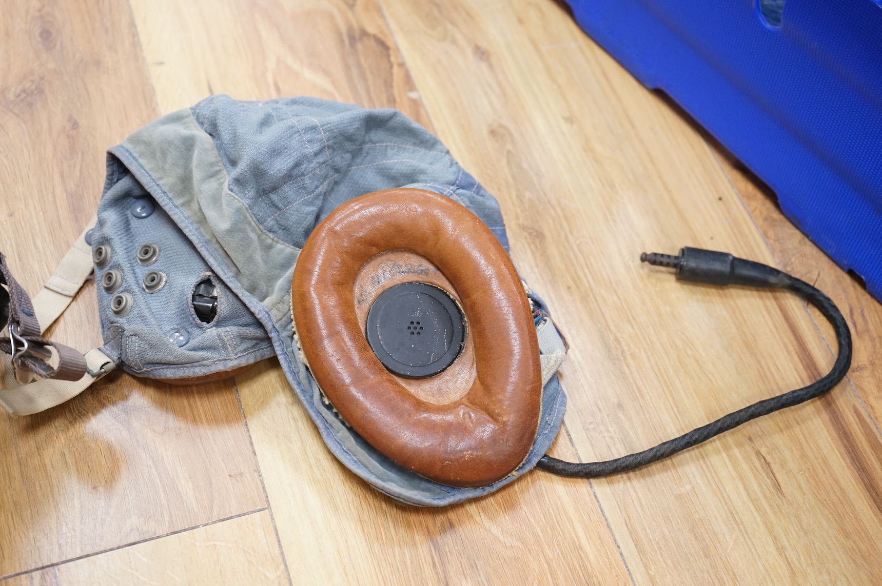 An early British jet aircraft RAF flying helmet, size 3 regular, dated 1958, with visor and visor cover, and original interior webbing, complete with inner cloth flight cap with built-in headphones and electrics and date